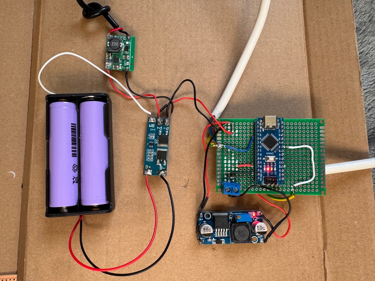 Automatic Solar Lighting battery pack, charging modules, Arduino Nano, and controller electronics