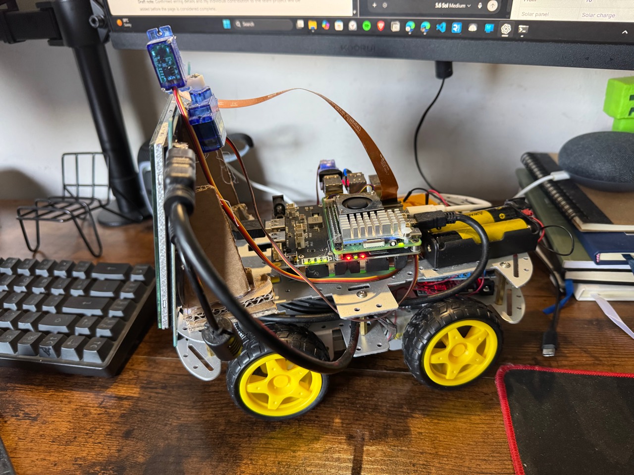 Right-side view of Bob AI rover showing its Raspberry Pi, battery pack, display, and chassis wiring